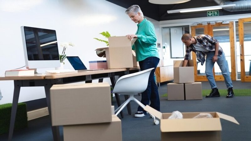 Office moving companies Exeter NH staff relocating desks and equipment
